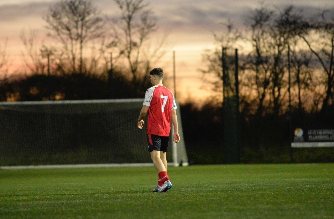 Harlyn Palmer, founder of AJH Technology, on the pitch in Needham Market FC kit